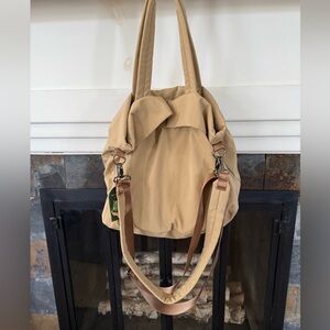Large Tan BAG with multiple straps. This Bag has several compartments. New!